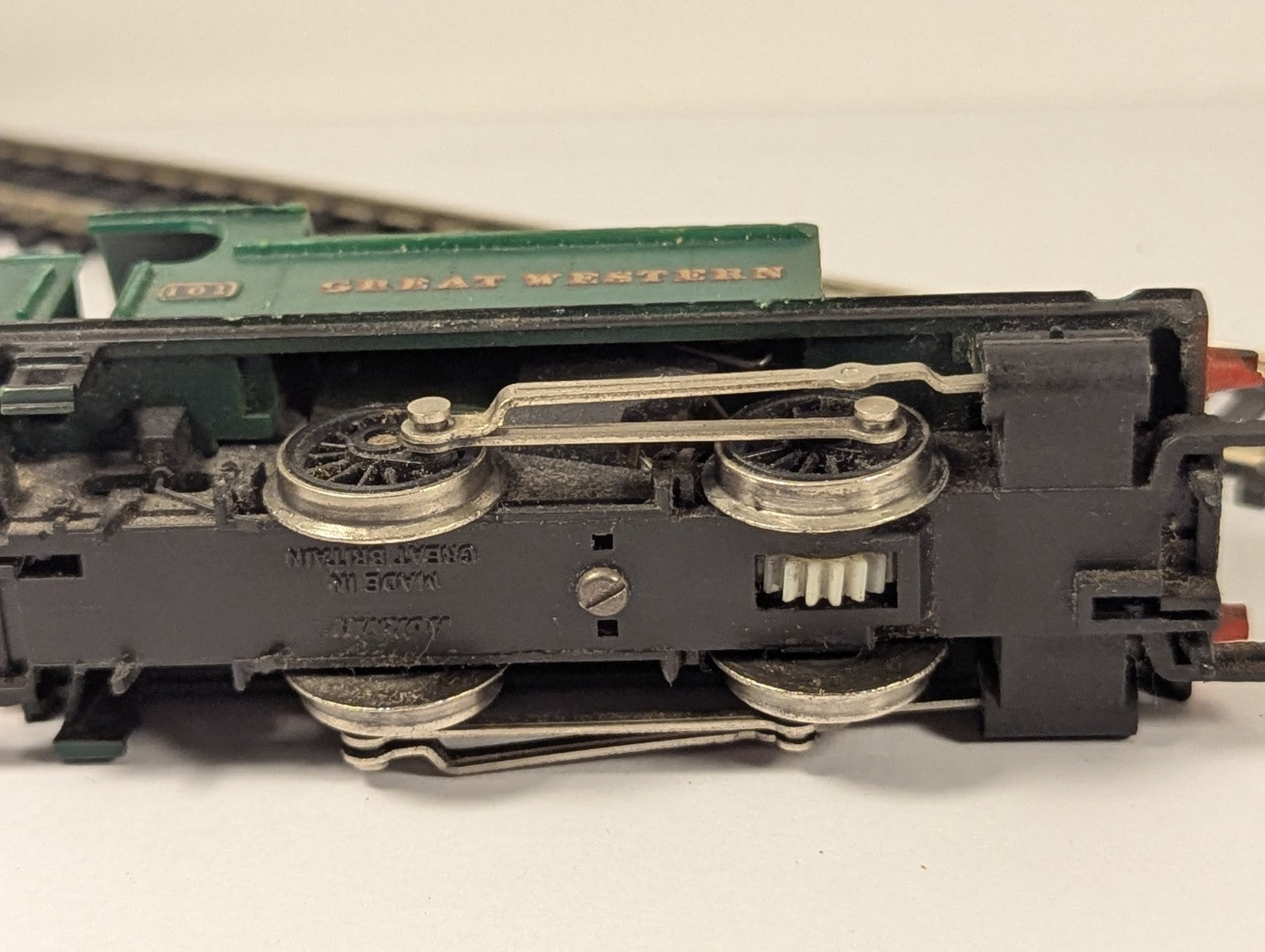 Underside view of Hornby OO Gauge Holden Class 101 0-4-0T locomotive showing wheels and gear mechanism
