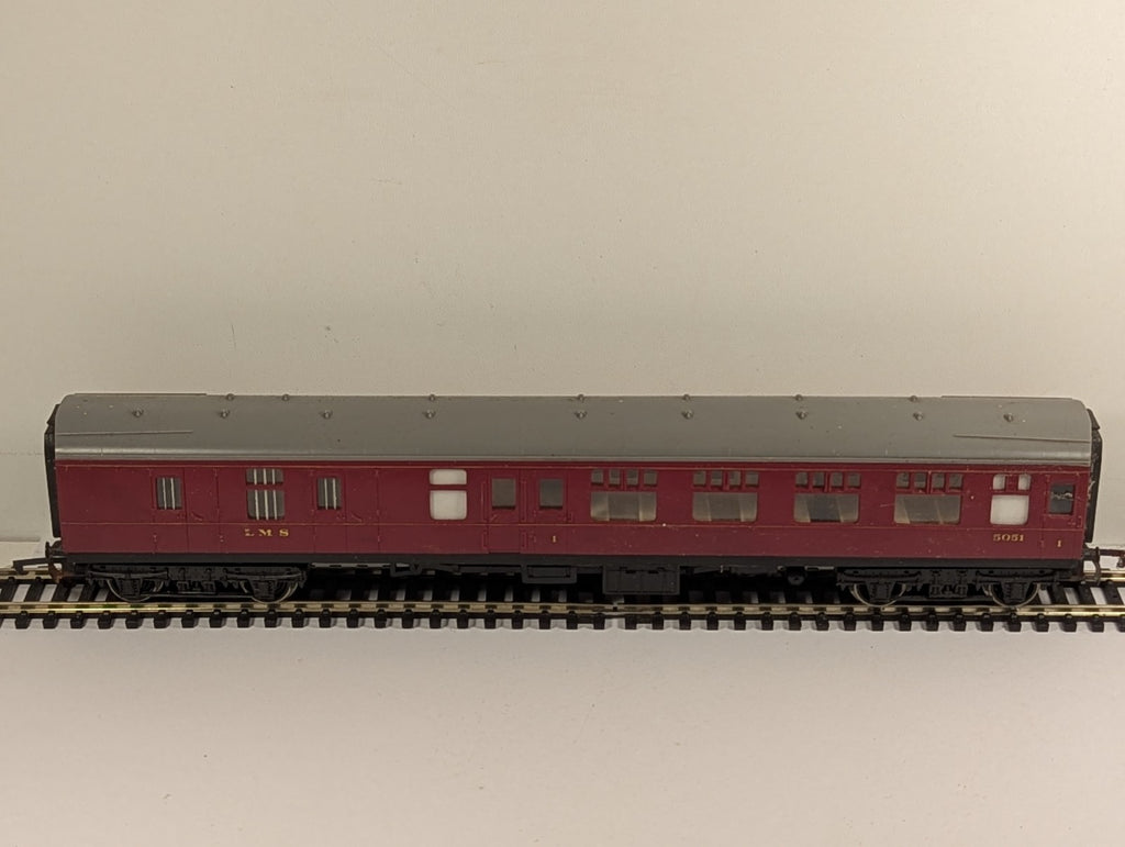 Hornby OO gauge LMS brake third passenger coach 5051 in crimson livery on model railway track