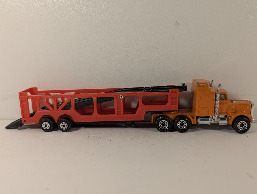 Matchbox 1:100 Kenworth Aerodyne Car Transporter Die-cast Truck Orange and Red