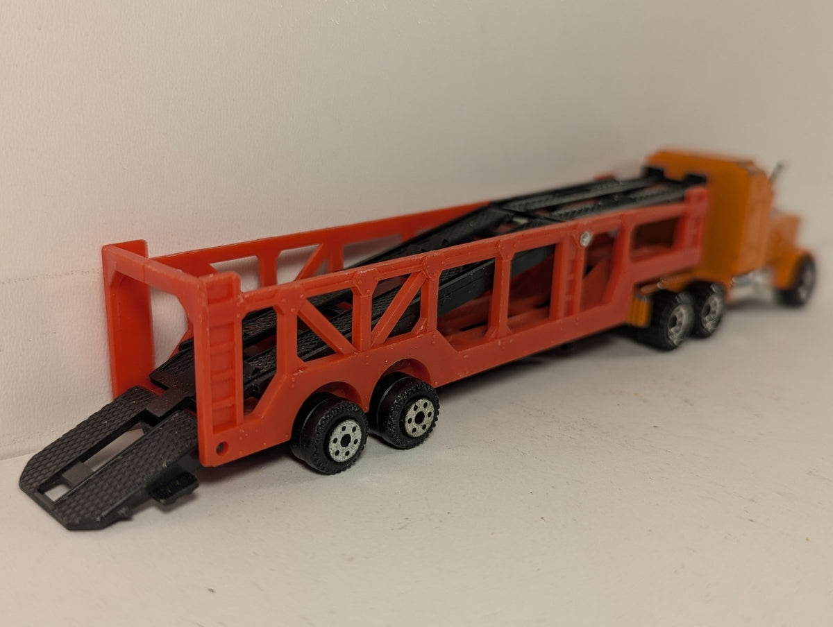 Matchbox 1:100 Kenworth Aerodyne Car Transporter Die-cast Truck Orange and Red