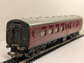 Hornby OO Gauge LMS Brake Third passenger coach in crimson livery on model railway track
