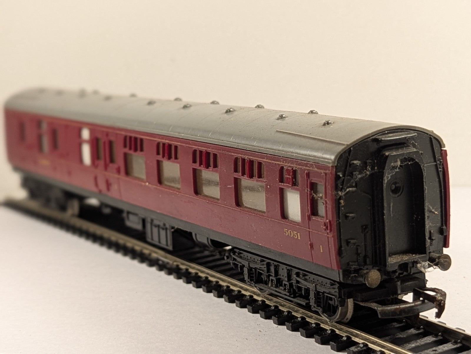 Hornby OO gauge LMS crimson brake third passenger coach 5051 on model railway track