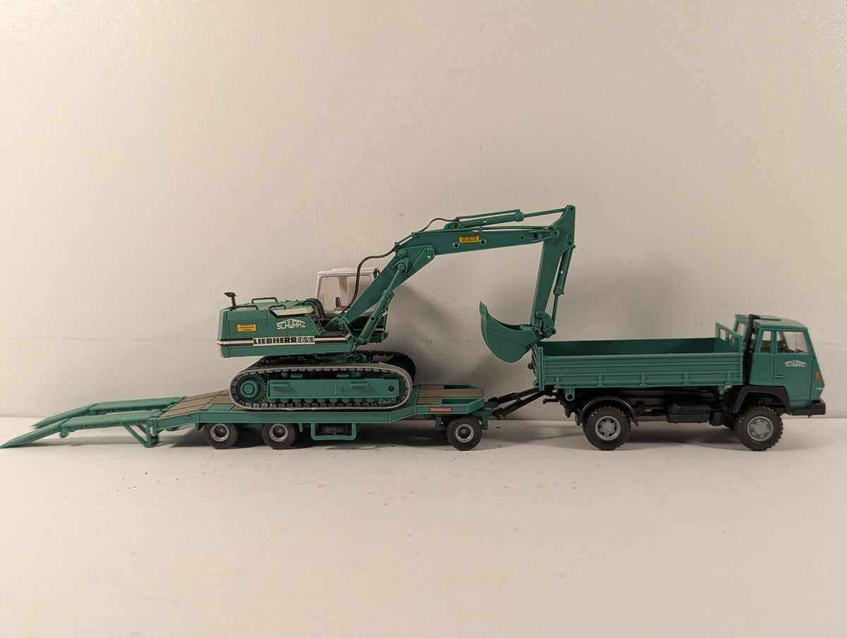 Roco 1516 Steyr 91 Tipper 922 Excavator finished in Schwarz Bau AG livery