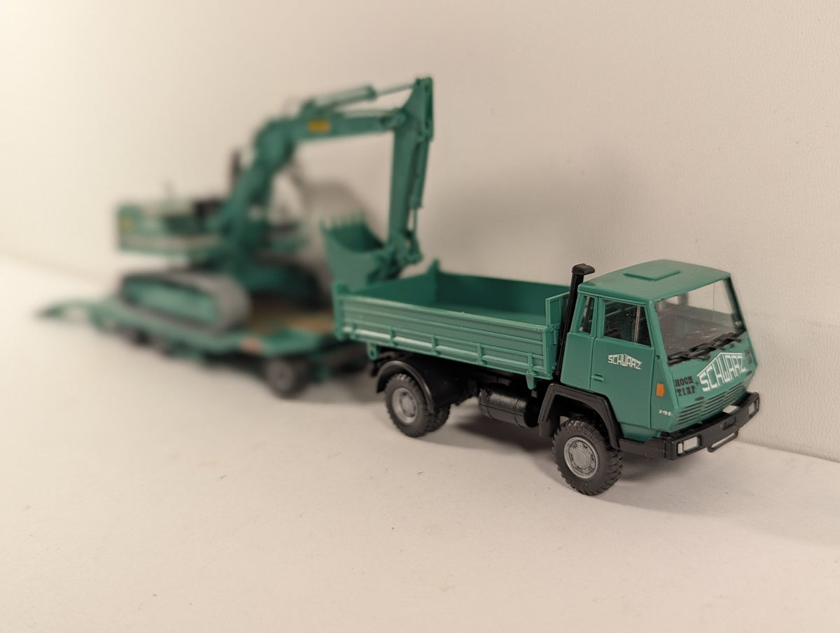 Roco 1516 Steyr 91 Tipper 922 Excavator finished in Schwarz Bau AG livery
