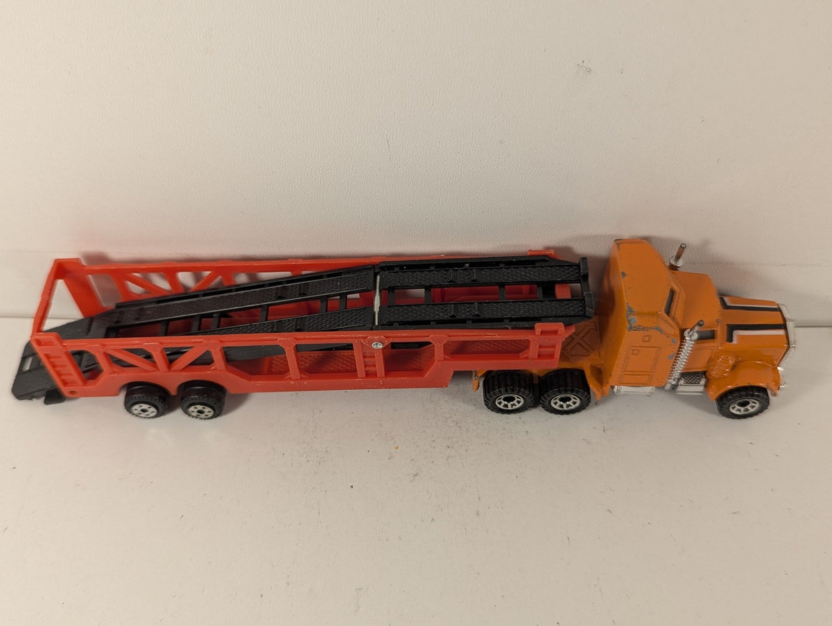 Matchbox 1:100 Kenworth Aerodyne Car Transporter Die-cast Truck Orange and Red