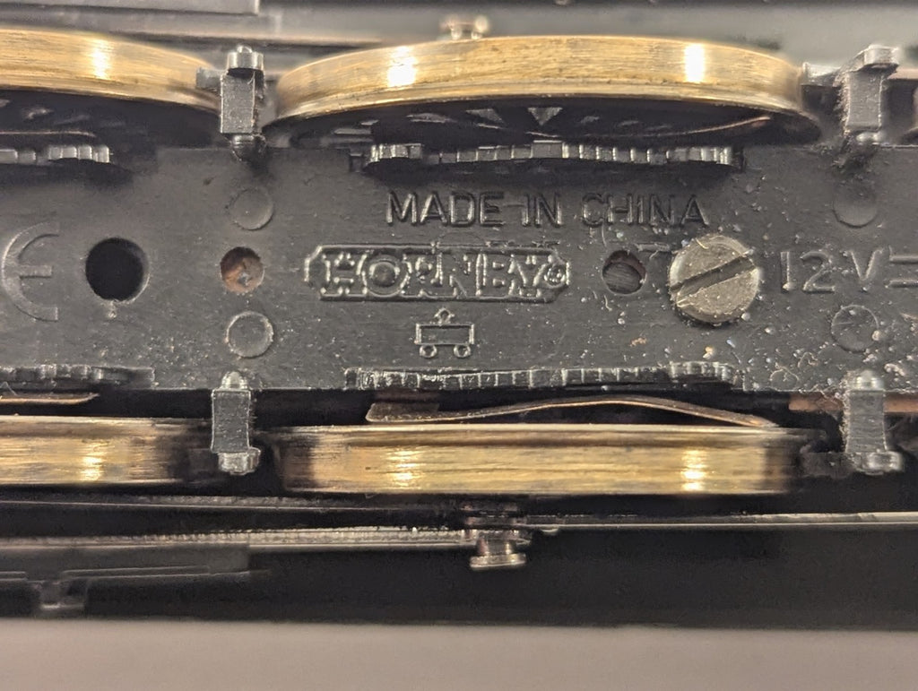 Underside of Hornby OO Gauge GWR Castle Class 5074 Hampden Castle showing manufacturer markings and metal wheels