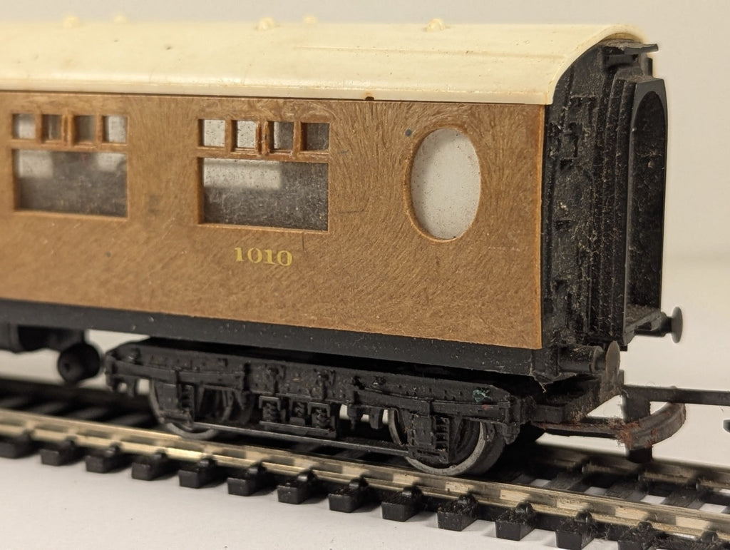 Tri-ang OO Gauge LNER Composite Coach 1010 in teak finish on model railway track