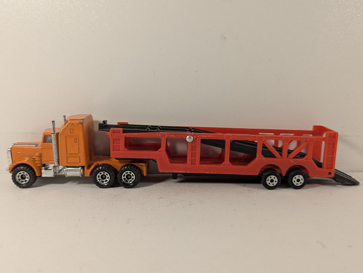 Matchbox 1:100 Kenworth Aerodyne Car Transporter Die-cast Truck Orange and Red