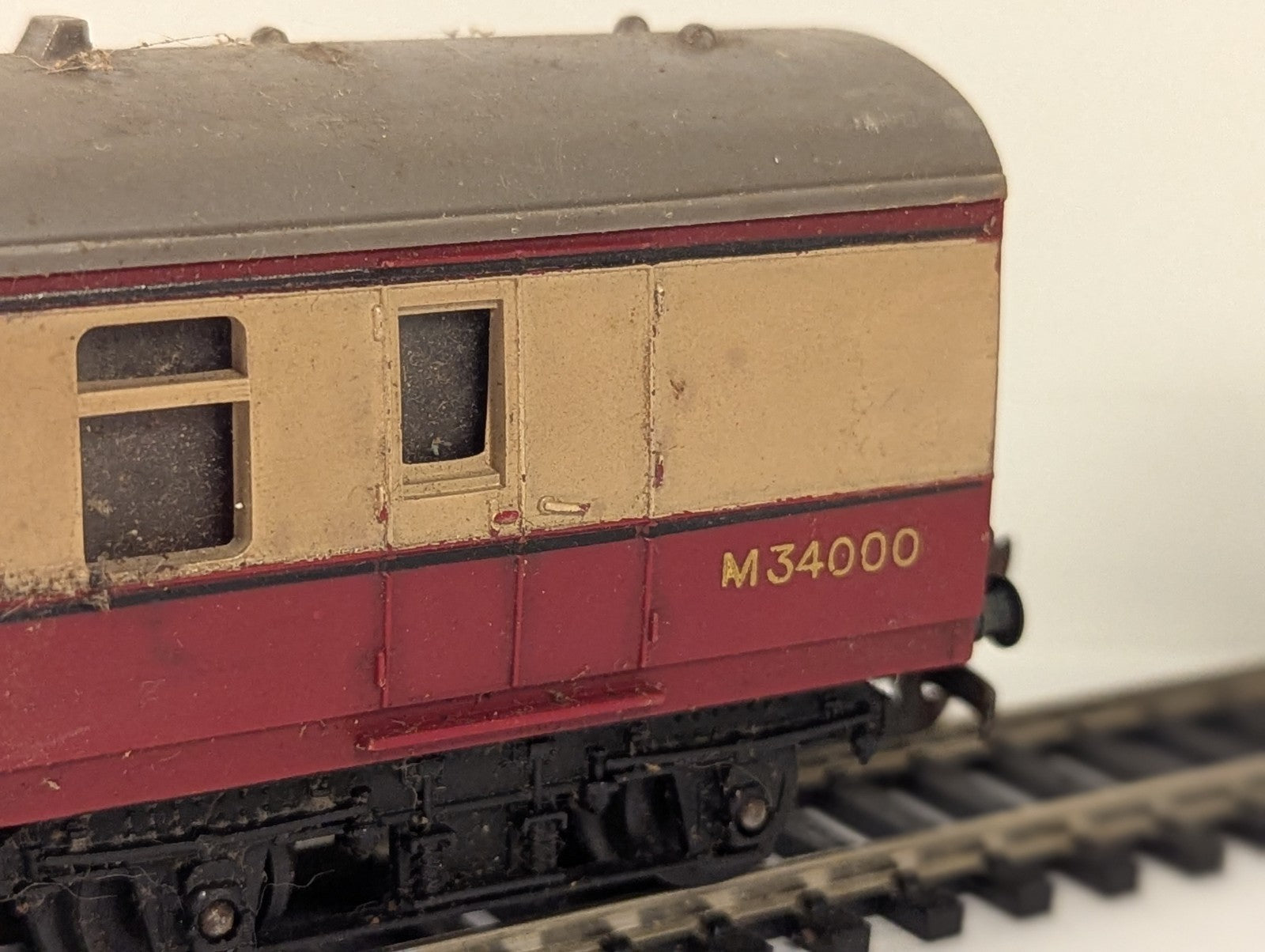 Tri-ang OO Gauge BR Crimson and Cream composite passenger coach on model railway track