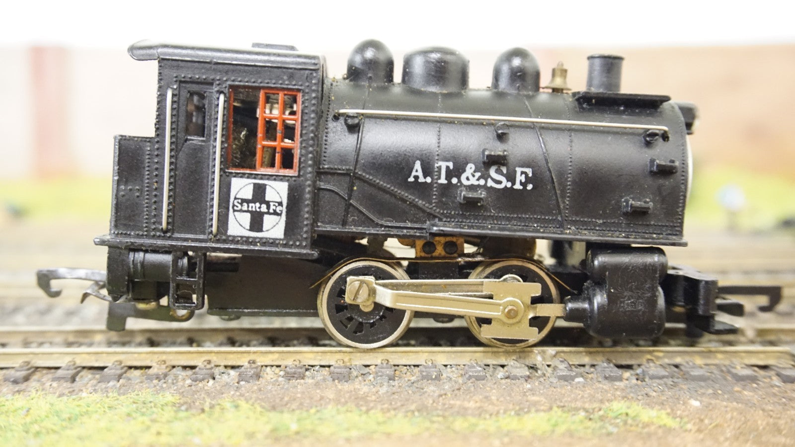 Life-Like HO scale black AT and SF steam locomotive model on train tracks