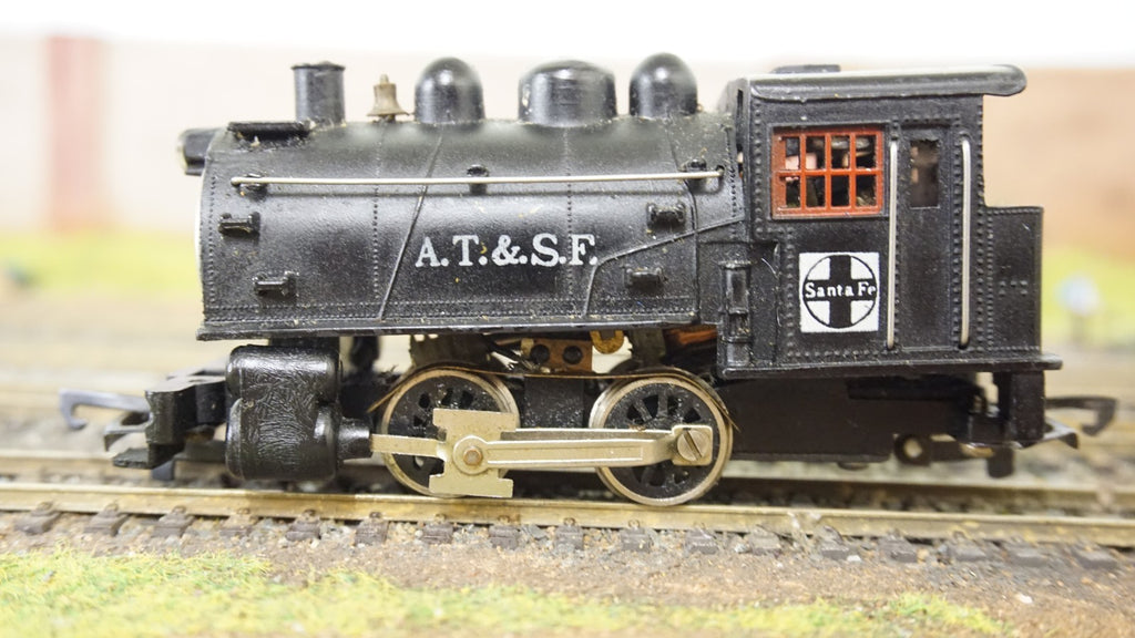 Life-Like HO scale black AT and SF steam locomotive model on train tracks