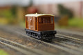 Hornby OO Gauge BR brown 20 ton brake van model on railway tracks