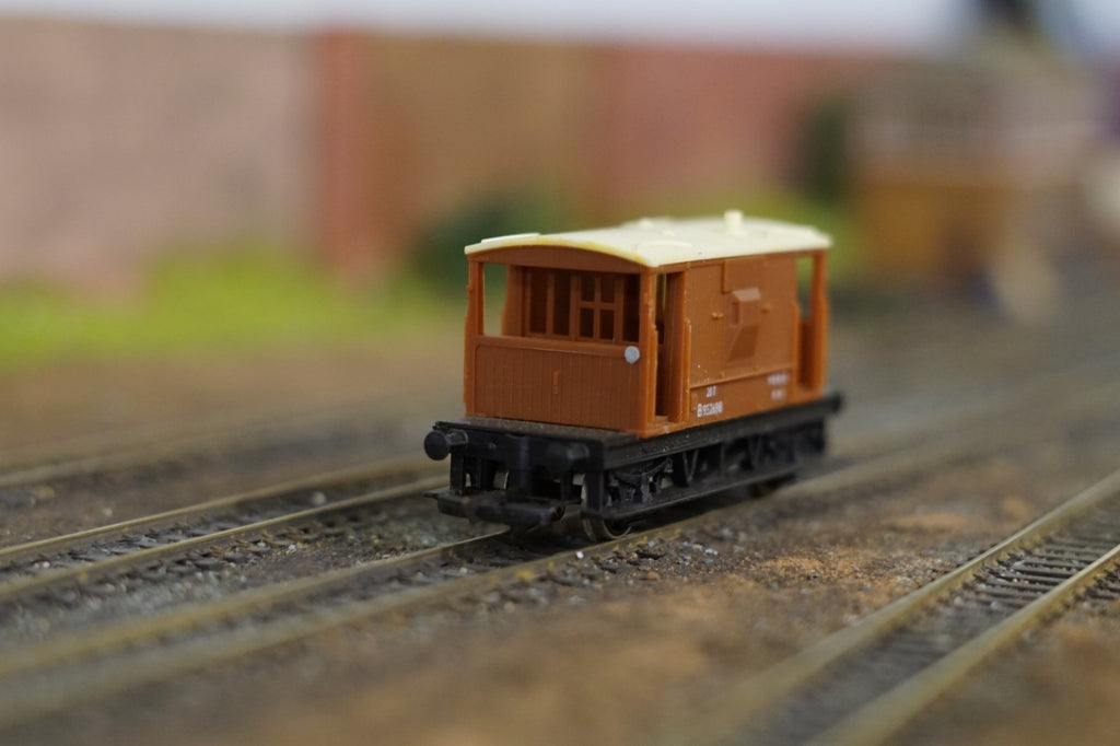 Hornby OO Gauge BR brown 20 ton brake van on model railway tracks