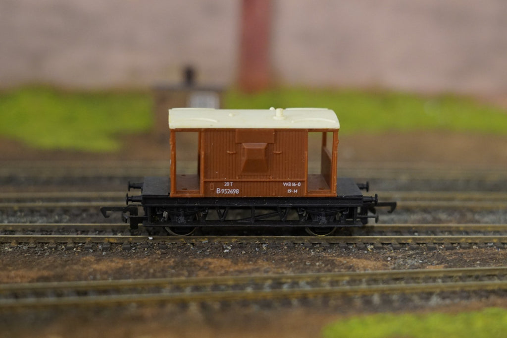 Hornby OO Gauge BR brown 20 ton brake van on model railway tracks