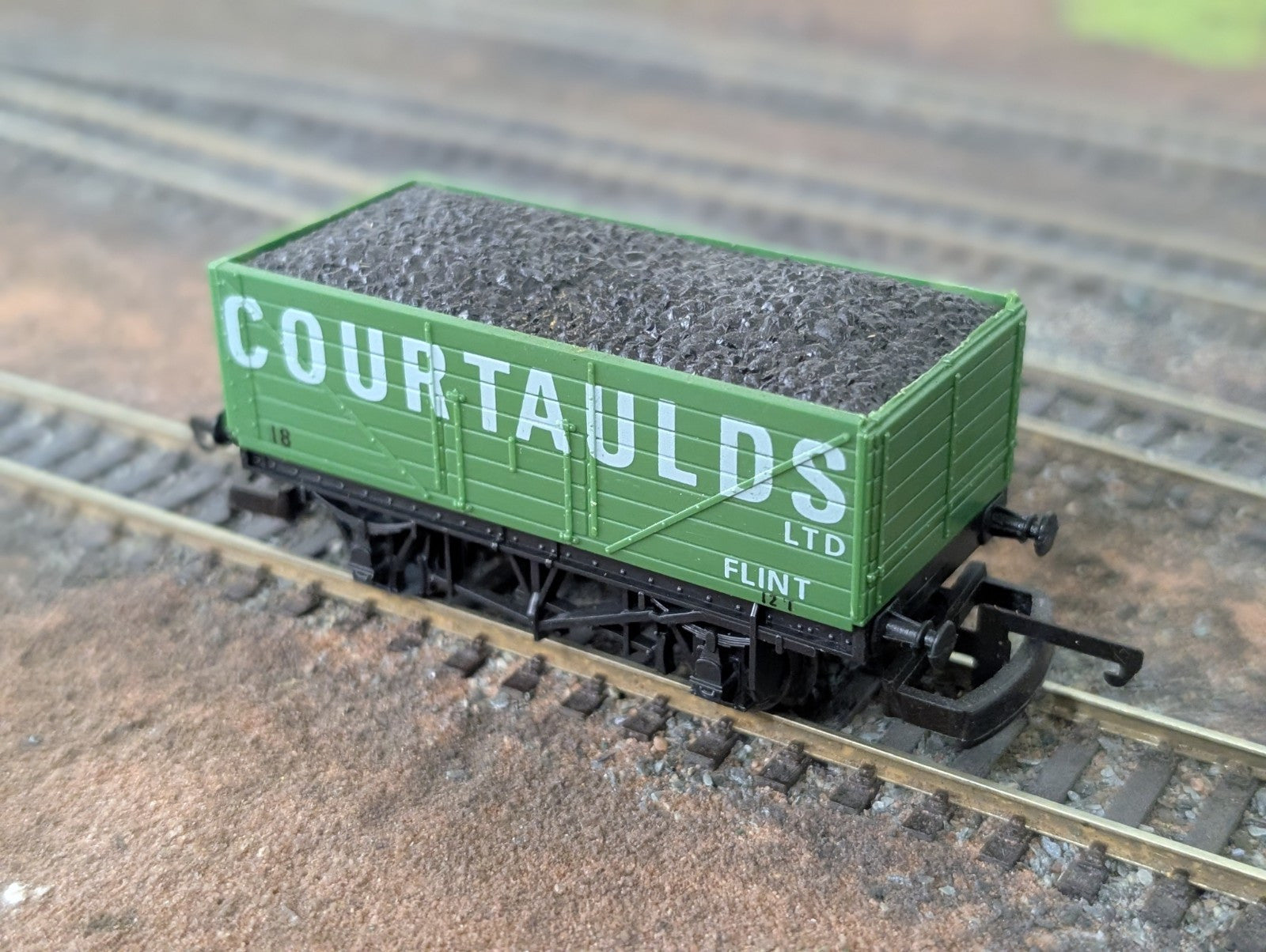 Lima L305678 7 plank wagon Courtaulds model on railway tracks