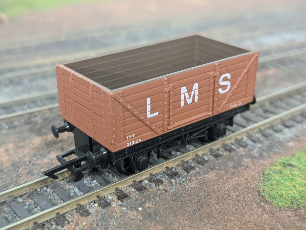 Graham Farish 12101 LMS 7 plank wagon in bauxite livery on OO gauge model railway track