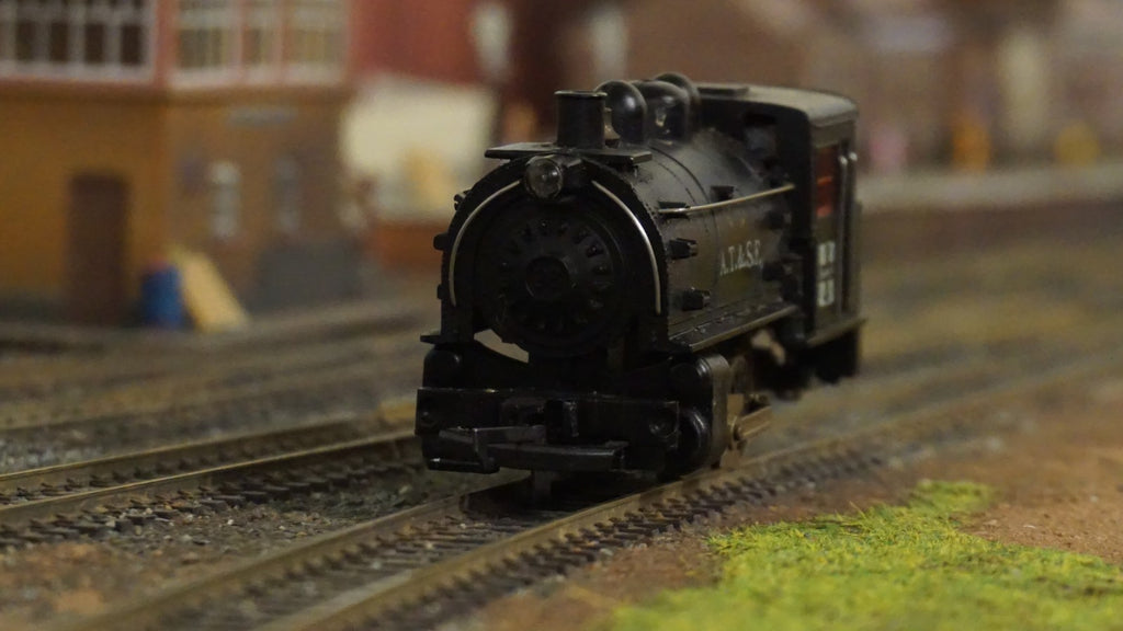 Life-Like HO scale black ATSF steam locomotive model on train tracks
