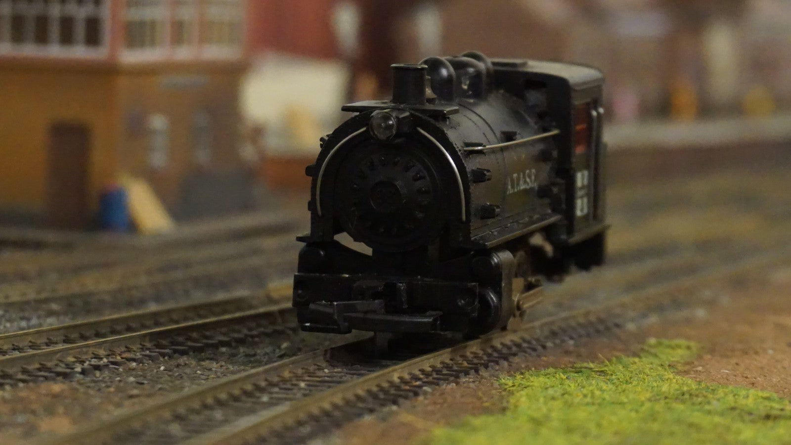 Life-Like HO scale black ATSF steam locomotive model on train tracks